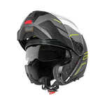 Schuberth C5 MC-hjälm med öppningsbar design, svart med gula detaljer och integrerat visir. Perfekt för stadskörning.